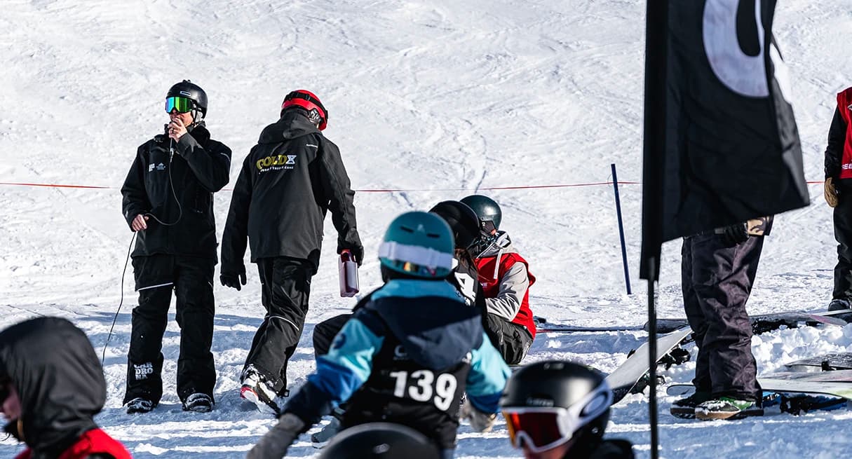 Two staff members help ensure an event runs smoothly up the mountain.