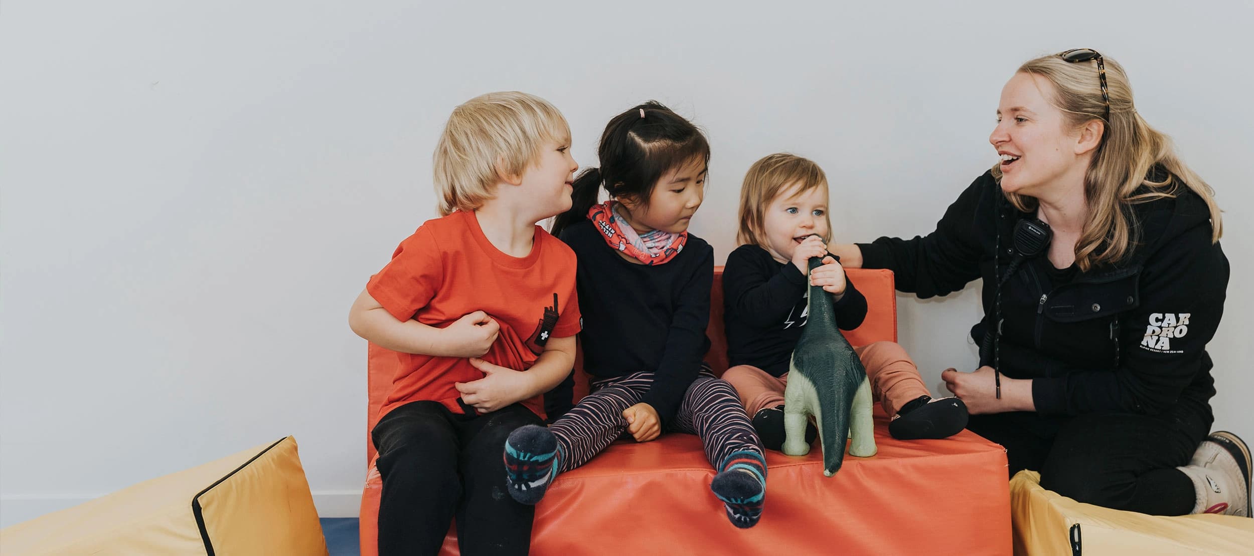 A womans plays with the kids enrolled at the Cardrona childcare centre.