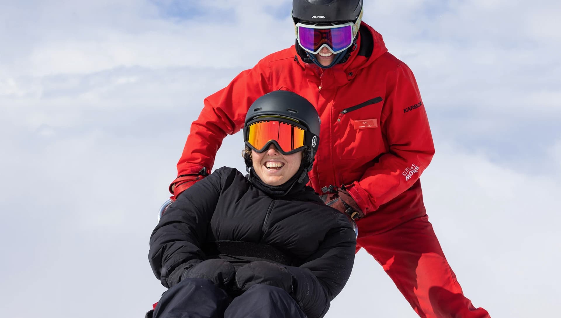 A lady enjoys an adaptive skiing lesson at Cardrona Alpine Resort.