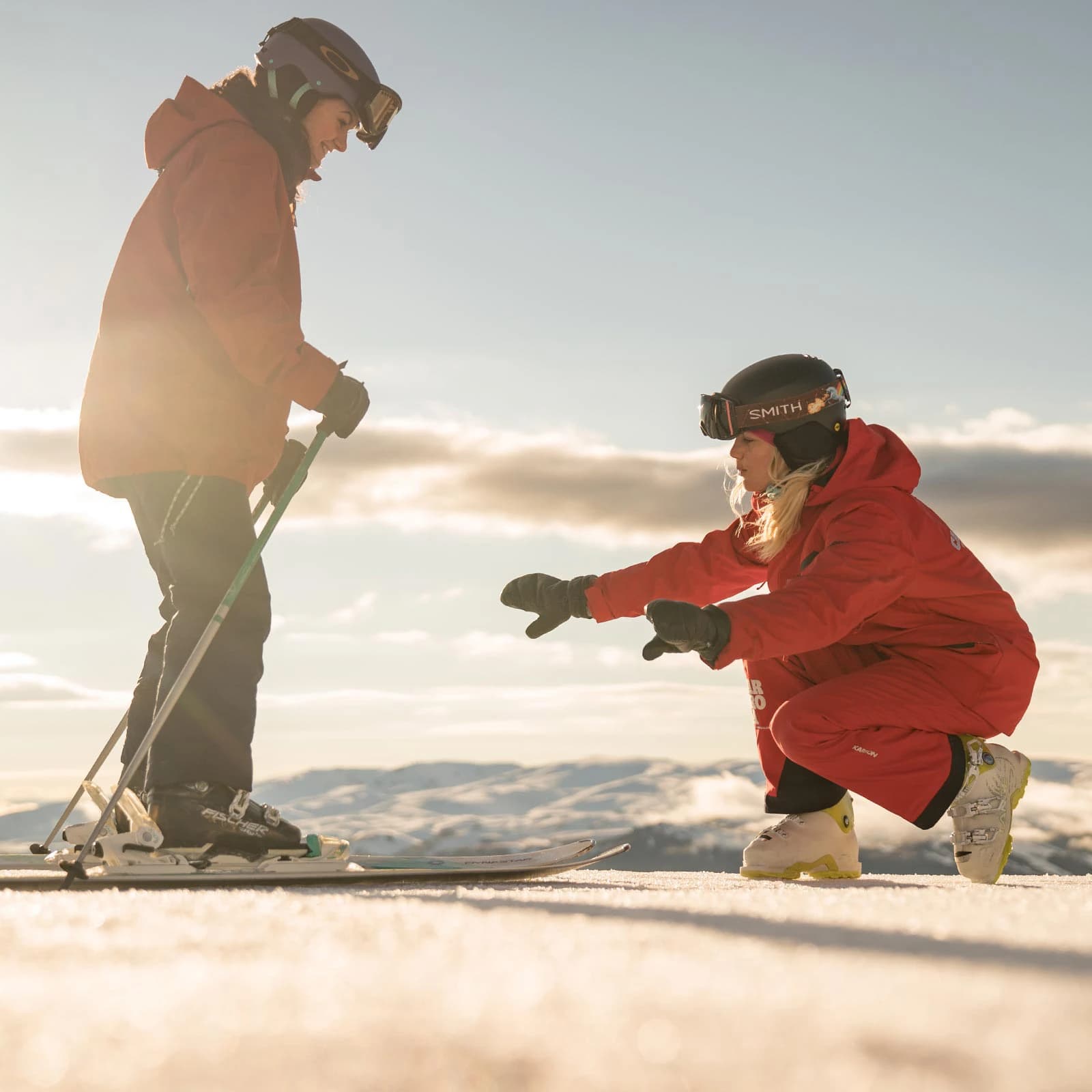 Leaners ski lesson at Cardrona and Treble Cone, New Zealand, with instructor guiding student to learn to ski. 