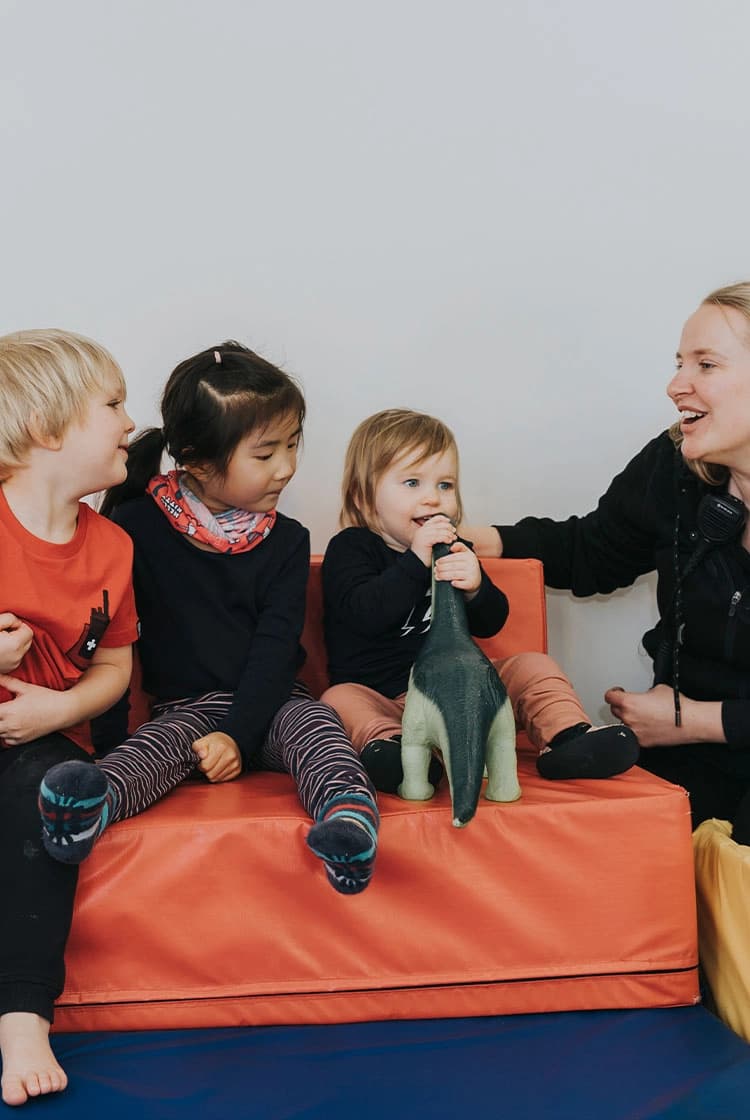 A womans plays with the kids enrolled at the Cardrona childcare centre.