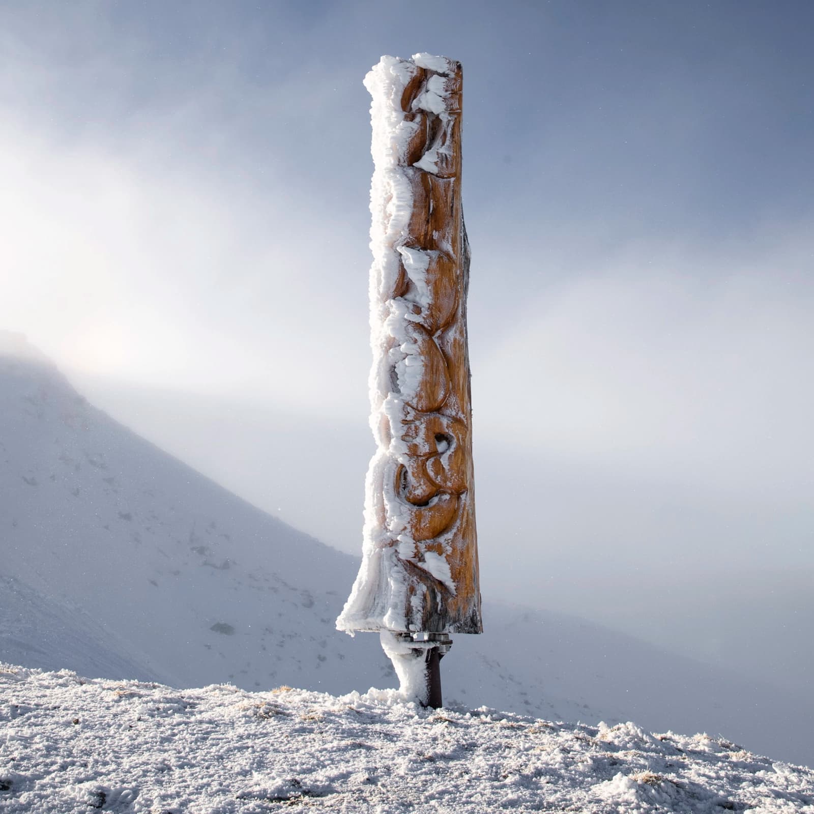 A Maori carving covered in snow up at Cardrona.