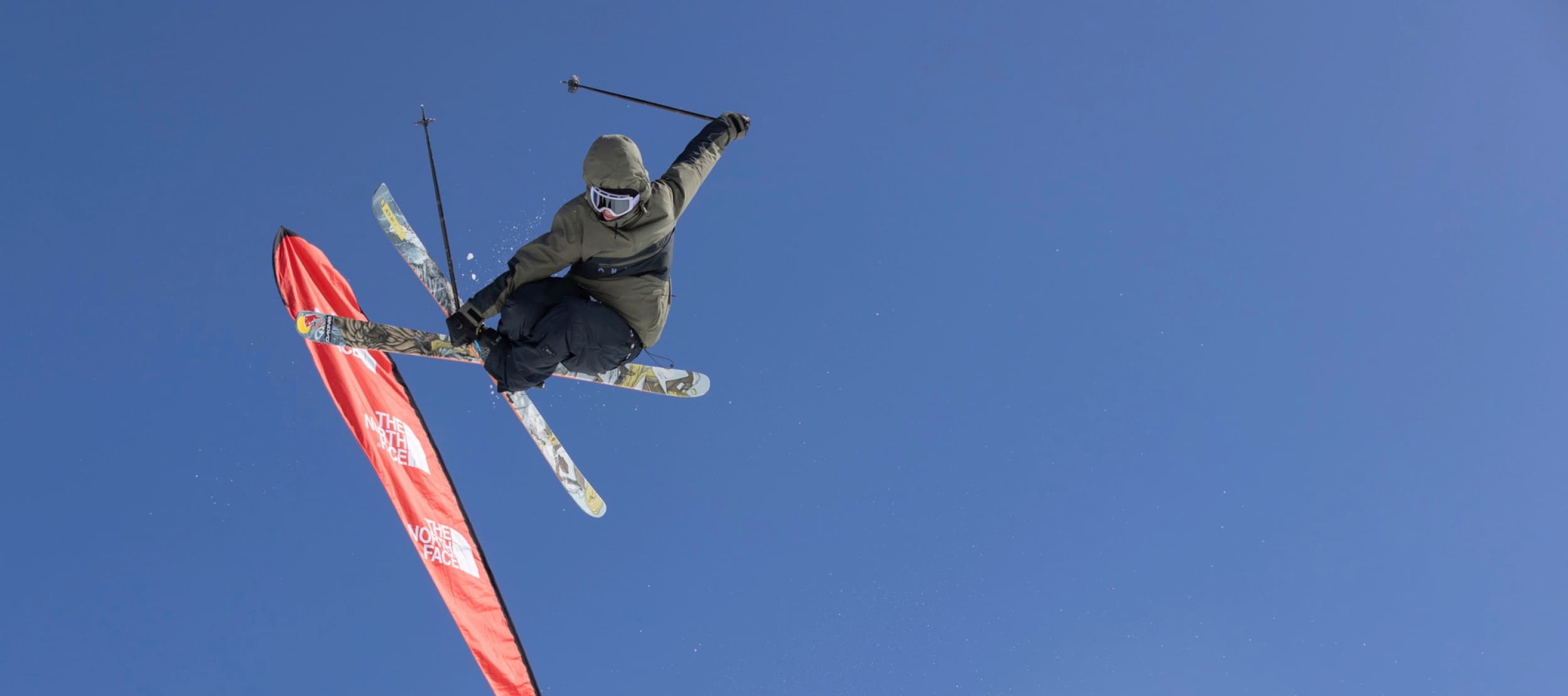 Skier at Cardrona Alpine Resort doing an aerial trick