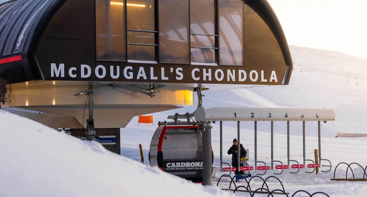 The McDougall’s Chondola at Cardrona Alpine Resort, showing the lift station and a gondola cabin ready for passengers on a snowy morning.
