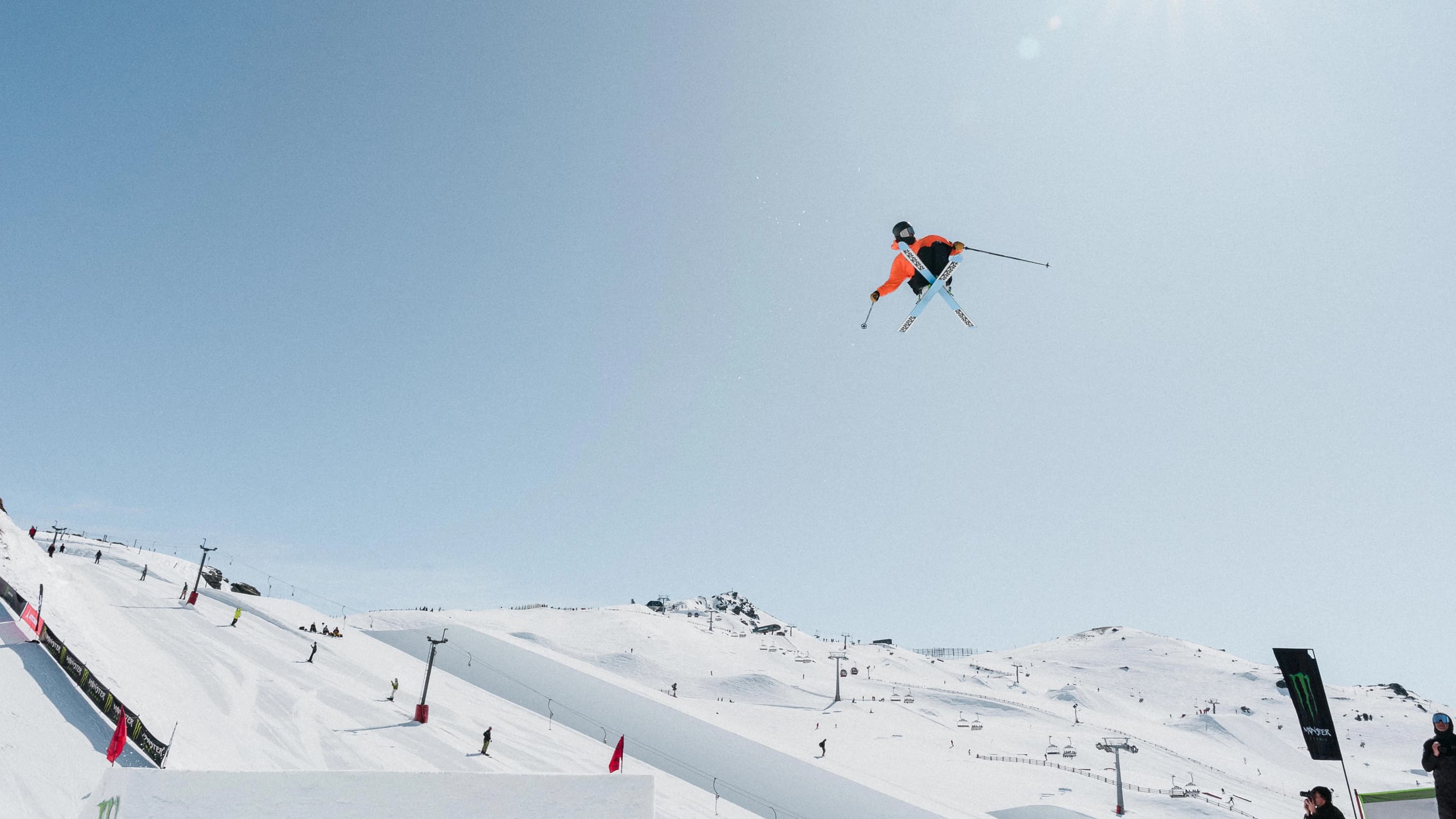 Freestyle skier mid-air performing a trick at the Jossi Wells Invitational at Cardrona.